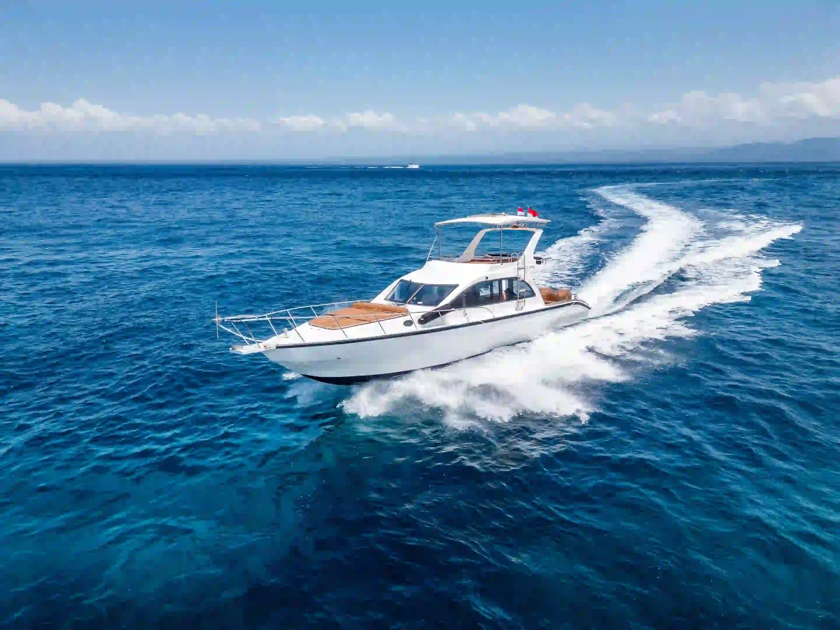 A charter yacht under way across open water